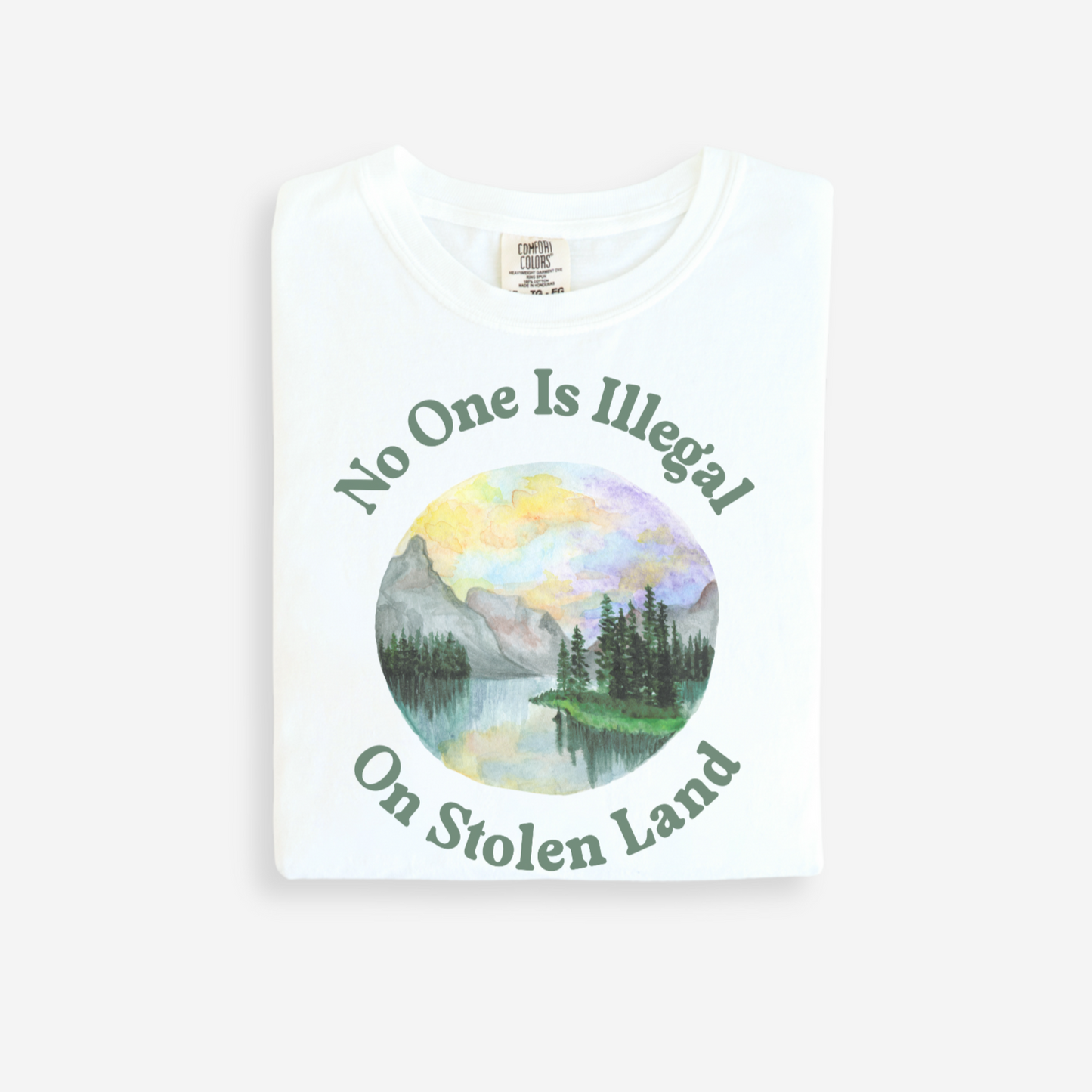 White t-shirt with nature graphic and text on a white background