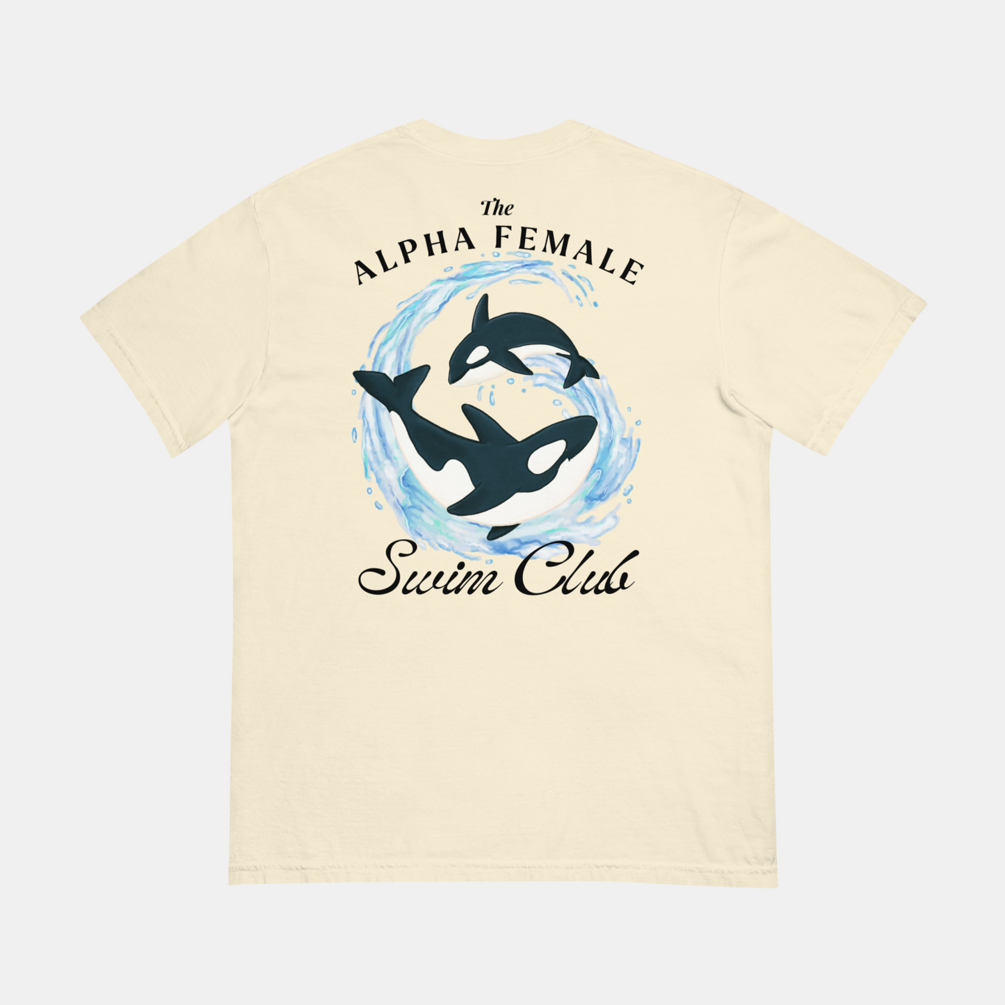 Beige t-shirt with 'Alpha Female Swim Club' graphic featuring orcas on a white background