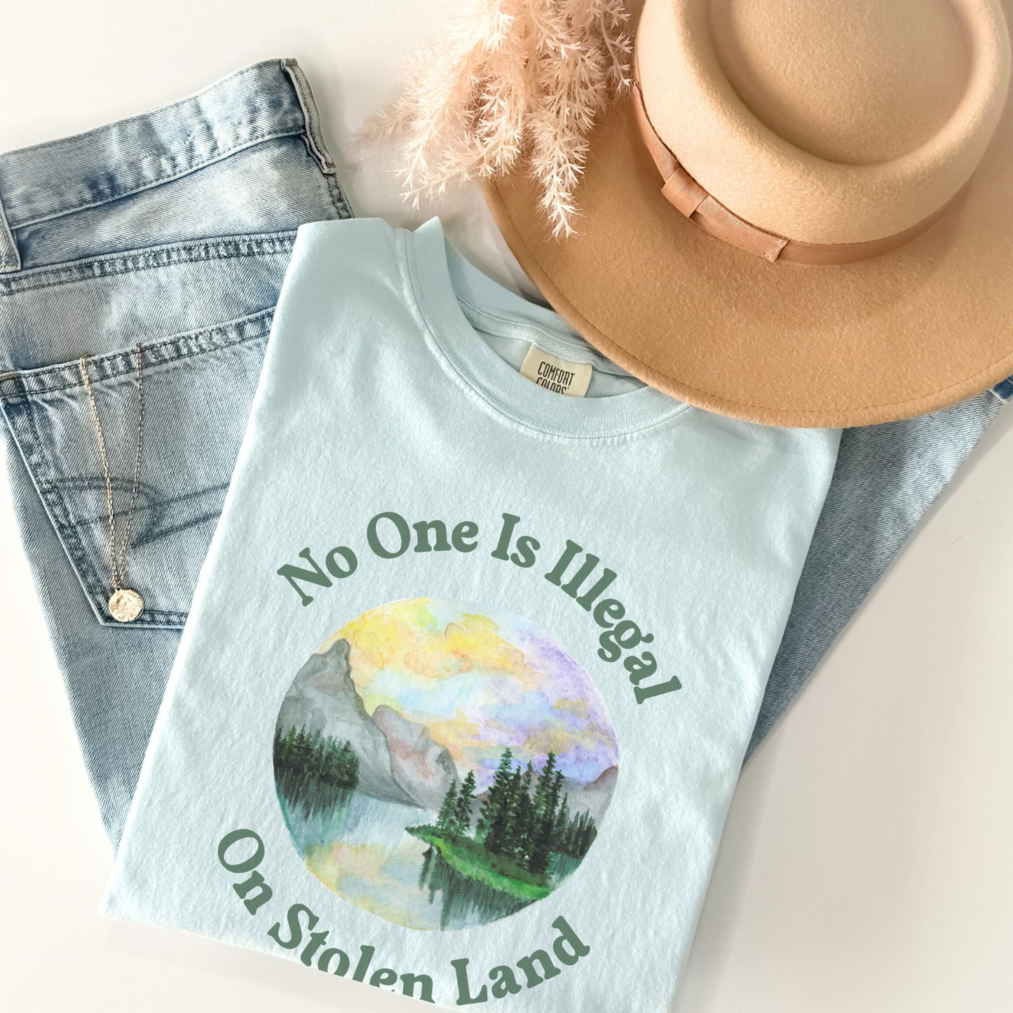 STOLEN LAND PRO-IMMIGRANT Statement Tee