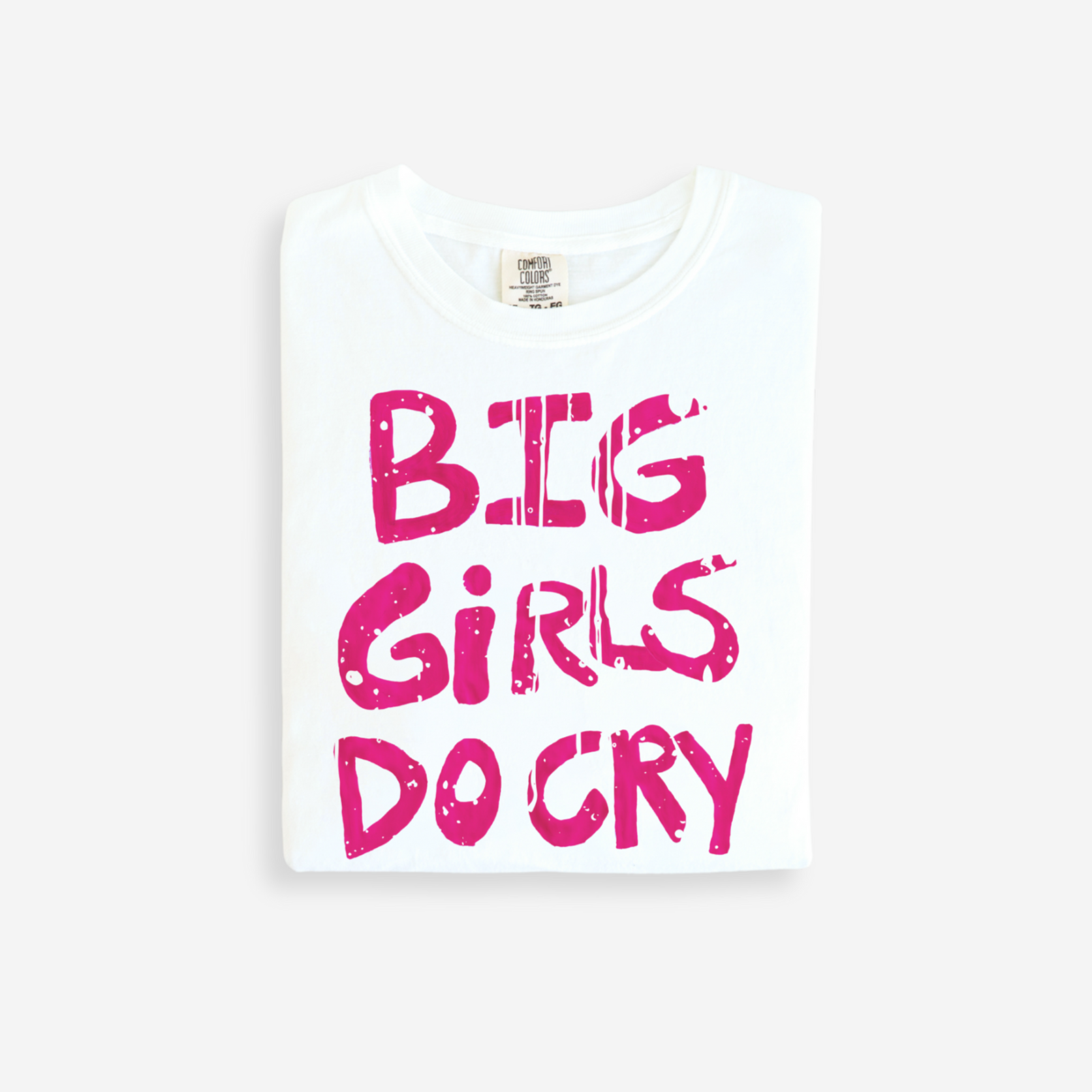 White t-shirt with pink text 'BIG GIRLS DO CRY' on a white background