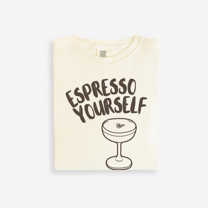 Beige t-shirt with 'Espresso Yourself' text and espresso cup graphic on a white background