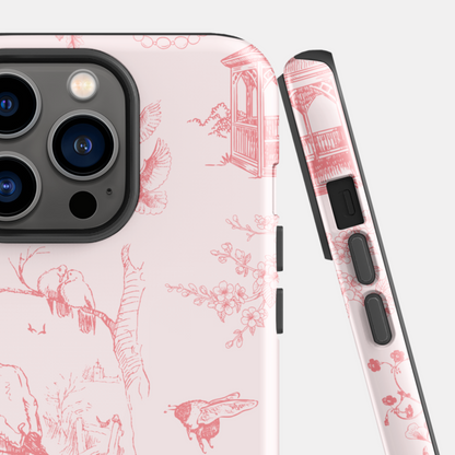 Phone case with red floral and bird pattern on a light background