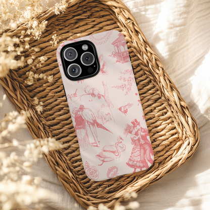 Phone case with pink and white design on a woven tray with dried flowers